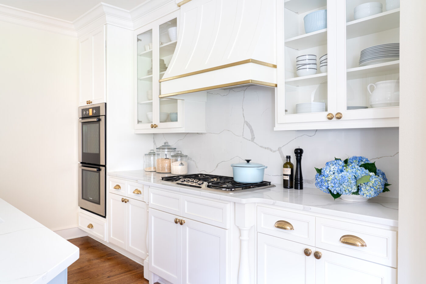 kitchen remodel with white cabinets and brass hardware